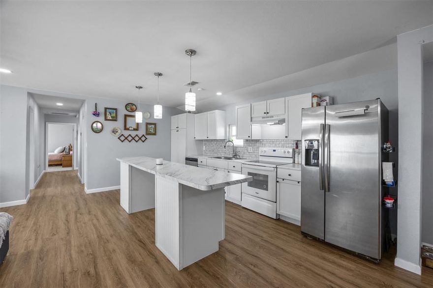 This beautifully remodeled 4-bedroom, 3-bathroom home sits on a spacious 1-acre lot and offers the perfect blend of modern comfort and country charm. Completely remodeled from the studs up in 2022, no detail was overlooked—this home is like new inside and out! This property boasts all upgrades—from the metal roof to the commercial-grade gutters, windows, paint, flooring, lighting, cabinets, water heater, AC, the whole deal! If you're looking for a home that’s been carefully updated with modern touches, this is it! The open-concept floor plan seamlessly connects the living, dining, and kitchen areas, creating a perfect space for family gatherings or hosting friends. The kitchen is a true highlight with sleek white cabinetry, granite countertops, and a spacious island that invites you to cook, dine, and entertain. Two of the four bedrooms are master suites, both offering their own attached full bath with beautiful, marble tiled walk-in showers—an ideal setup for multi-generational living or privacy for guests. The main master suite is thoughtfully positioned on the opposite side of the home from the other bedrooms, offering a peaceful retreat from the bustle of the household. Step outside and enjoy the large screened-in back porch, an inviting space for sipping your morning coffee or enjoying an evening breeze. The property also includes a water well and best of all, comes with no known restrictions, allowing you the flexibility to truly make this space your own. You will fall in love with the quiet and peaceful life this property can bring you! Just 10 minutes from Highway 45 and all major shopping, dining, and entertainment!