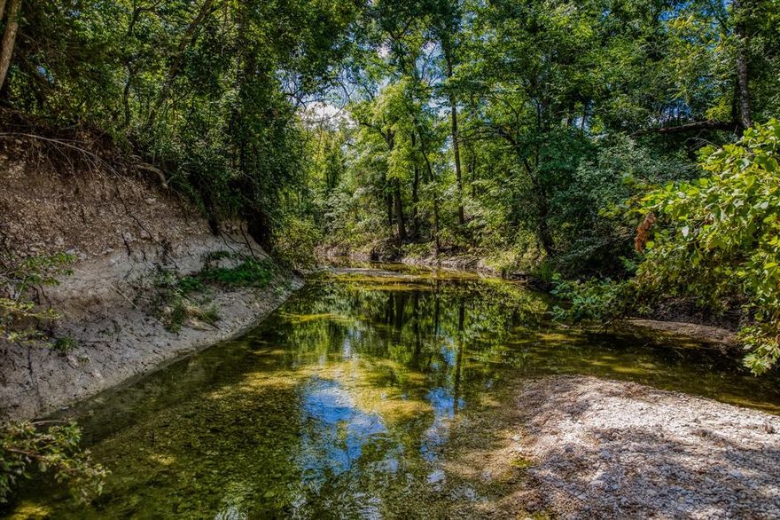 Vista Creek Ranch is 305 acres of dramatic elevation changes, over a half a mile of dependable Coryell Creek, huge Pecan and Oak trees, rock bluffs and overhangs, and even a ranch house to stay in! This property has been in the same family for generations where it has been used for cattle production and hunting and recreation. There are two ponds, three fenced pastures, an older metal barn with pipe working pens, and a three bed, two bath brick house with garage. The water is a co-op water meter. The access is ideal being on scenic Farm to Market Road 182 just minutes to restaurants, HEB, etc. in Gatesville. This ranch is a true gem in the rough. This property has it all and could be a true showplace with some brush clearing. Call today for a private showing.