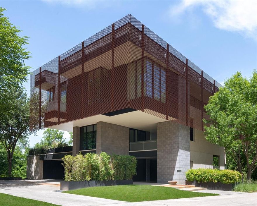 Designed by Internationally known Tod Williams Billie Tsien Architects & featured in Architectural Digest, this home is an exceptional work of art. Incomparable Design of Steel + Glass+ Concrete floating above the everyday in this Modern Treehouse. It is ordered vertically & the main, 3rd level floats above other two. The distinct 3rd level red iron sun baffle is as beautiful as it is functional in the TX heat & the cantilevered design gives shade to 2nd & 1st levels while allowing full natural light for art collections. Sunset facing pool uniquely rests among the treetops as does the outdoor kitchen & seating areas. Main living is on the third level & features the master suite, office, gourmet kitchen, living & dining rooms. This high-end custom home is anything but ordinary. Bring your most discerning buyers!