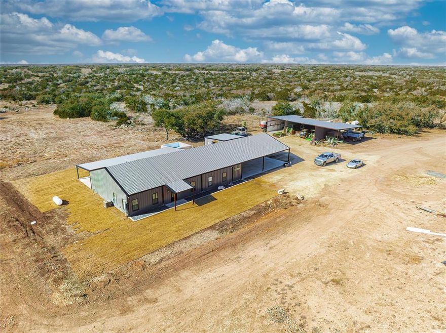 The ranch perimeter is high fenced without any cross fencing in the pastures. The ranch has a stunning 2,500 square feet house barndo with an amazing finish out. The house is 4 bed, 4 baths with attached covered carport and covered back patio which extends the length of the house. There is an outdoor cantina which is perfect for entertaining friends, family, or clients. The cantina is complete with a bar top and all the amenities needed to spend time after the hunt! An outdoor concrete formed swimming pool is perfect for those hot afternoons or cool evenings while waiting for the next hunt. There is a 3-sided equipment barn perfect for keeping all your equipment out of the elements. A cleaning rack, game cooler, and processing station are all in place. A new 1+- acre stock tank was recently finished being built and currently being filled with water. This stock tank was professionally build and sealed properly to hold water. Three soft release pens are setup behind the barn. Stands and feeders are all premium quality including Texas Wildlife Supply Tower Blinds, Phantom Ground Blinds, Ranch King Feeders, and more. This is a true turnkey, show up and hunt property ready for its next owner! The ranch has an impressive herd of improved genetic Whitetail and multiple Exotics. The animals on the property include the following: Whitetail, Blackbuck, Fallow, Axis, Red Stag, Nilgai, Zebra, Scimitar Oryx, Impala, Dama Gazelle, Springbok.
The ranch has 2 of its own water wells. One solar, the other is electric. There is also a shared well off the property that comes with the ranch with 3rd interest in the shared well. These wells produce between 6 and 20 GPM depending on the well. The ranch has a slightly rolling terrain with a total elevation change across the ranch of approx. 60 feet. Native brush covers the property with some cleared openings for shooting lanes and food plots.