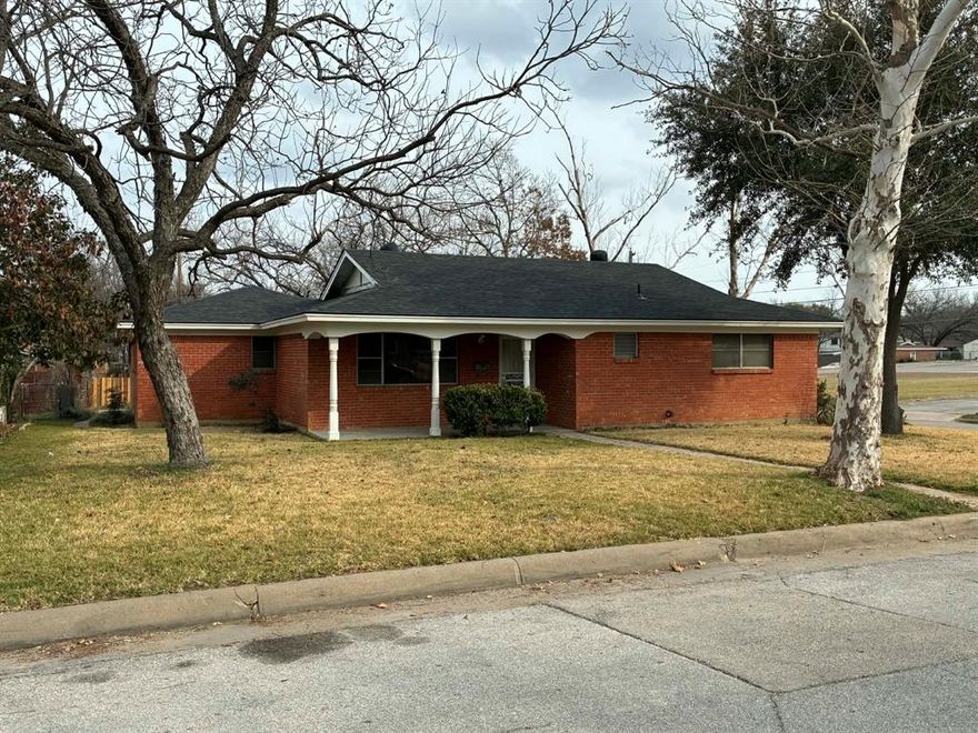 Charming, character-filled 2-bedroom, 2-bath home with two spacious living areas nestled on a landscaped large corner lot shaded by mature trees, creating a peaceful, park-like setting. Updates including a newer roof, HVAC, and water heater. From the moment you step inside, you’re welcomed by an oversized front living room filled with natural light that could double as 3rd bedroom and a hallway featuring built-ins, closets, and a privacy door leading to the main living area. The cozy main living room showcases wide tongue-and-groove pine walls, custom built-in cabinetry with doors and open shelving, and plush carpet. The kitchen continues the rich wood theme with painted tongue-and-groove pine accents and offers custom cabinetry, tile countertops, electric cooktop, separate oven, built-in desk area, table with bench seating, and exceptional storage throughout, charm  & functionality. The utility room accommodates a full-size washer and dryer, space for an additional refrigerator or freezer, a huge walk-in pantry, and convenient access to both the garage and backyard. Hall bath delights with nostalgic retro pink tile, oversized soaking tub, tile counters, generous storage, and vintage Frederick Emmet Rowland wallpaper that adds timeless personality. Bedrooms are generously sized, while the primary suite features two walk-in closets and a private ensuite bath with shower, tile wainscoting, medicine cabinet, and decorative lighting. Step outside to enjoy the expansive covered patio, ideal for morning coffee or evening entertaining, overlooking the private backyard complete with a custom attached greenhouse for gardening enthusiasts. Rear driveway provides ample additional parking for guests, hobbies, or recreational vehicles. Conveniently located near Eastern Hills High School, shopping, dining, and the highly rated Meadowbrook Golf Course, this truly special home blends vintage charm, thoughtful updates, and inviting spaces — ready to welcome its next owner home.