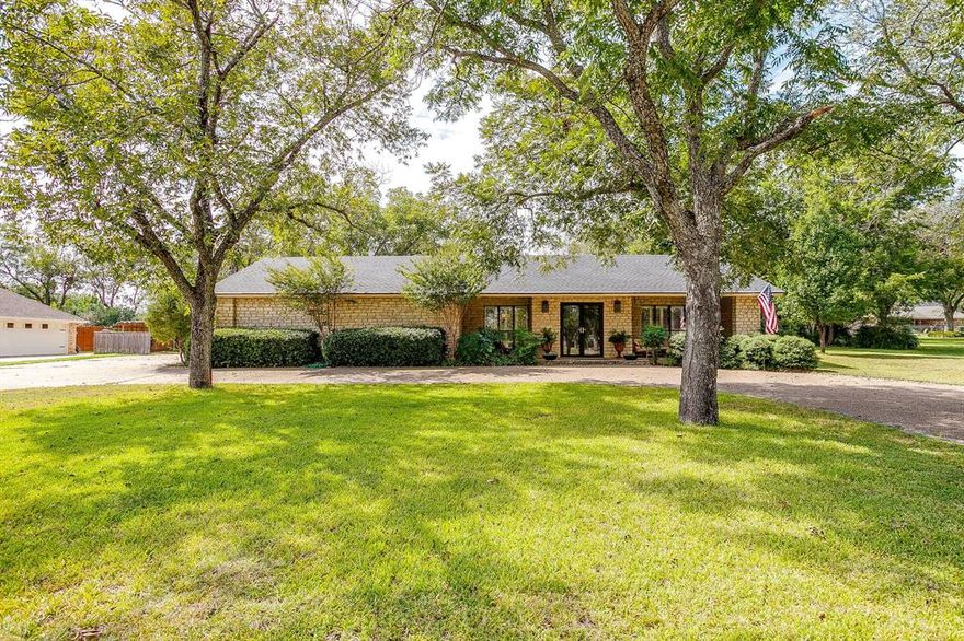 Prime Golf Course Location in Pecan Plantation! Nestled between the 16th green and 17th tee box of the Pecan Golf Course, this home sits on just under a half acre and offers one of the best settings in the community. Perfect location for watching golfers, deer, or morning walkers.  Just a short golf cart ride to the clubhouse, you’ll enjoy sweeping views, established shade trees, and a park-like backyard. Recently painted, the home features a circular driveway, plantation shutters throughout, and an ideal two bedroom layout, each with its own full bath plus a powder room for guests. The living room showcases a striking stone wall and wood-burning fireplace, while large windows fill the home with natural light. The kitchen includes granite countertops and newer appliances, and wood flooring accents the bedrooms. Outdoor living is a highlight with covered and open patios, a brand-new backyard fence, and beautiful landscaping with a sprinkler system (heads replaced in 2024). Additional upgrades include a new roof, gutters, skylights, and a new HVAC system. Parking is a breeze with a two-car garage plus a golf cart garage. This is a rare opportunity to own a move-in ready golf course home in one of Pecan Plantation’s most desirable locations!  Search YouTube 'Everything about Pecan Plantation Rebecca Van Buren' to learn about our amazing community.