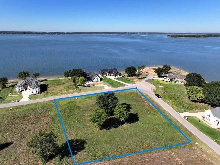 Beautiful sunsets and open water views from this corner lot right across the street from the lake. Located in the elegant gated community of Cedar Creek Landing. This area has invisible edge pool, clubhouse, boat launch and more. Also joins Cedar Creek Country Club for golf and many more amenities if wanted. Large lot at over half an acre would make a premier building site. Seller has had soil core test done. High quality builders in the area.
