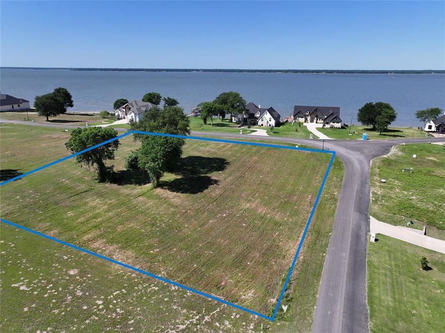 Beautiful sunsets and open water views from this corner lot right across the street from the lake. Located in the elegant gated community of Cedar Creek Landing. This area has invisible edge pool, clubhouse, boat launch and more. Also joins Cedar Creek Country Club for golf and many more amenities if wanted. Large lot at over half an acre would make a premier building site. Seller has had soil core test done. High quality builders in the area.