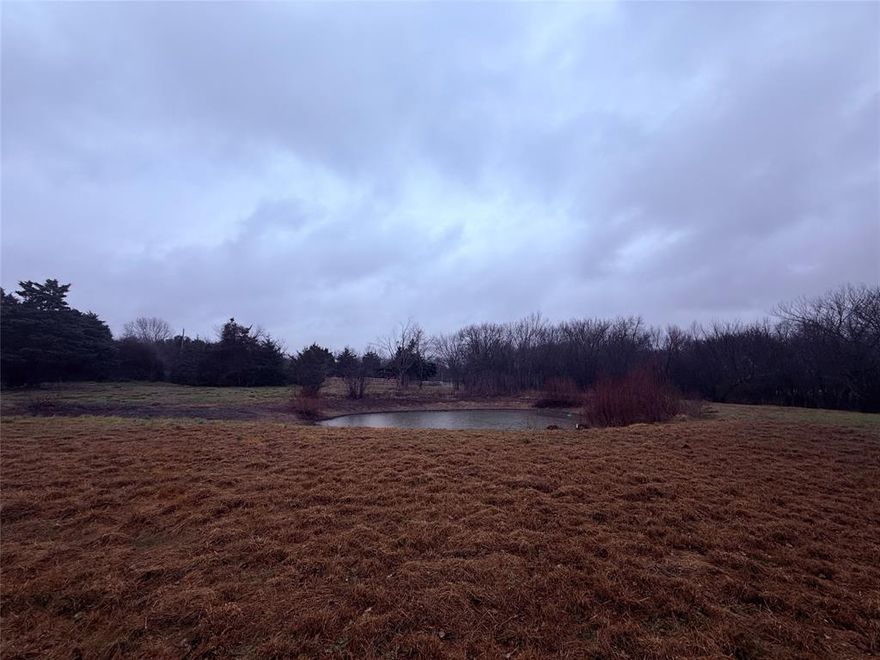 Discover the ideal blend of peaceful country living and in-town convenience with this 9+ acre property just outside the Farmersville city limits. Perfect for residential, agricultural, or recreational use, this versatile acreage is ideal for families, hobby farmers, ranching enthusiasts, or those seeking land to build a custom dream home. Conveniently located near schools, baseball fields, and town amenities, while still offering privacy and open space. The property features mature trees, a serene pond, and gently rolling land, creating a scenic and functional setting. All utilities are already in place, including water meter, electric meter, and septic system, providing a head start for future construction. Additional improvements include multiple storage buildings, a designated RV parking area, and two large barns ready for livestock, equipment, or workshop space. Whether you’re looking to build, farm, invest, or enjoy wide-open Texas land, this Farmersville acreage offers endless possibilities. Schedule your private showing today and explore the potential of this exceptional property.