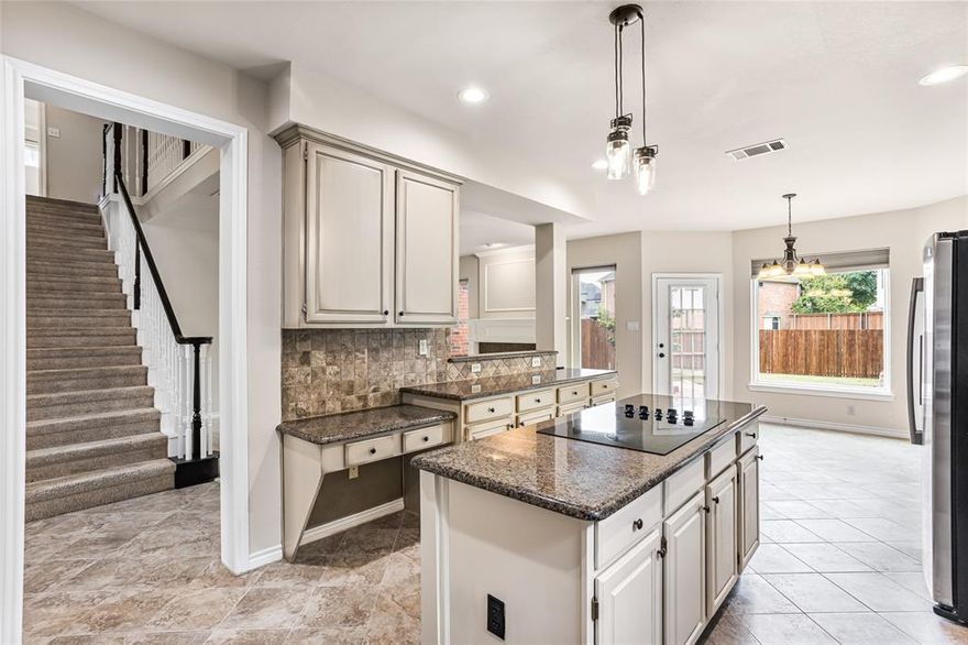 Enjoy all this updated Hunters Creek home, with its blend of comfort, functionality, and space, has to offer. The excellent floor plan flows from a dramatic entry and split formals to a comfortable family room, with wood burning fireplace; stylish island kitchen, with granite counters, upgraded cabinets and stainless steel appliances; and breakfast area overlooking the spacious backyard, with towering tree, two expansive patio areas, stained, steel-post fence and attractive storage shed. This 2-story, 5-bedroom floor plan offers space and versatility. The bedrooms, most sizable and with a vaulted ceiling, are split three ways, with the primary bedroom thoughtfully placed for added privacy, and a downstairs guest room (or office) with direct access to a remodeled bathroom, one of three full bathrooms. (One of the secondary bedrooms upstairs also has direct bathroom access.) The remodeled primary suite boasts wood floors, a sitting area, with beautiful bay windows providing a backyard view, and a spa-like bathroom, complete with split vanities, large shower, and custom-designed walk-in closet. Additional features and upgrades include: Renewal by Andersen® windows; ceiling fans in living areas and all bedrooms; separate utility room, with electric & gas dryer hookups and room for a freezer; 2-car garage, with electric garage door opener; 2025-installed roof shingles and gutters; 17-SEER HVAC systems; 50-gallon gas water heater; and sprinkler system. Additionally, both the exterior & interior were painted in 2025, and the foundation was reinforced in 2022. Adding to the overall appeal, Hunters Creek, located in Denton County, and with low, mandatory association fees, is an established, treed neighborhood, minutes from all three Lewisville ISD-zoned schools, several major thoroughfares, and a DART rail station, and close to Lake Lewisville & DFW airport. Buyer and buyer's agent to verify all information, including, but not limited to, room dimensions, features & schools.