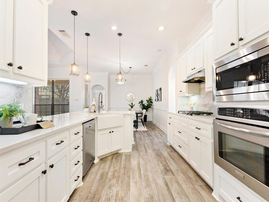 Tucked on a corner lot in Arlington, this beautifully refreshed three bedroom, two bath home blends comfort, style, and everyday functionality. The stone exterior and distinctive rotunda entry create a welcoming first impression. Inside, natural light fills the open living space where high ceilings and a gas log fireplace create a warm, inviting atmosphere for relaxing evenings or gathering with friends. The kitchen has been recently updated with quartz countertops, stainless steel appliances, and a breakfast bar that easily connects to the dining area, making everything from busy weekday mornings to weekend dinners feel effortless. Near the entry, a flexible room offers the perfect spot for a home office, playroom, or quiet reading space. The primary suite provides a peaceful retreat with dual vanities, a garden tub, separate shower, and a spacious walk in closet. Two additional bedrooms offer comfortable space for family, guests, or hobbies. The home will be freshly painted in a crisp white palette, creating a bright and modern feel throughout. Step outside to a fully fenced backyard featuring a covered patio ideal for outdoor dinners, morning coffee, or watching pets enjoy the dedicated dog run area. Just around the corner from O.S. Gray Natural Area and playground, you'll love having trails, green space, and outdoor recreation just minutes from your front door while still enjoying convenient access to shopping, dining, and the best of Arlington living.