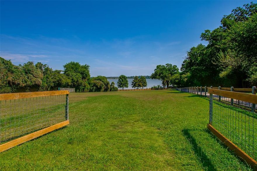 Welcome to this stunning estate located on the coveted Lawther Drive in Lakewood. Situated on 3.6+ acres of prime land along White Rock Lake, this property offers an unparalleled waterfront living experience. With 5 bedroom suites, 5 full baths, & 3 half baths, this home provides ample space & privacy for everyone. The interior boasts a gourmet kitchen with custom cabinetry & top-of-the-line Viking, Subzero, & Wolf appliances, perfect for the culinary enthusiast. Main living level features the primary & one additional suite in addition to 3 living areas. 2nd floor features 3 additional suites & game room with wet bar. Expansive 2,775 sq-ft basement for entertaining. Step outside to 13 car covered parking, 785 sq-ft full guest quarters, 3 stall barn, pool house, an 820 sq-ft workshop, & 2735 sq-ft of exterior patios & porches, ideal for entertaining guests or unwinding while taking in the breathtaking views. Don't miss this rare opportunity to own a piece of paradise on White Rock Lake.