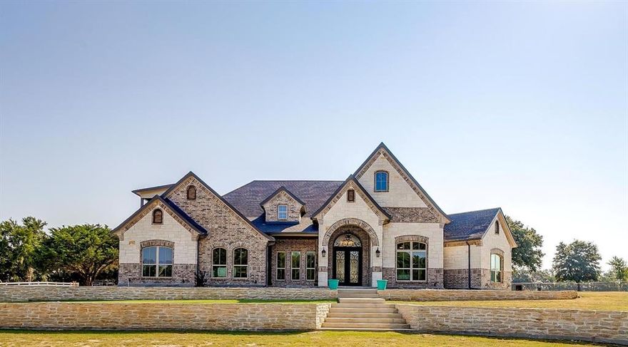 Luxurious French Modern Country Home on 2 Unincorporated Acres in De Cordoza Hills! NO HOA! 
Indulge in this blend of classic elegance and contemporary sophistication. As you step inside you will be greeted by soaring ceilings, open style kitchen, quartzite counters, premium appliances and a sprawling island perfect for culinary mastery. Dazzling entertainer's room off the patio with full wet bar, perfect for events or parties! Upstairs entertainment loft as well with wet bar with a balcony overlooking the views. This 4 bed 3 bath, 3600sq ft custom home sits on 2 acres with a 1 bed and 1 bath 600 sq ft apartment. Sumptuous master suite is a serene retreat, boasting a spa inspired bath and a lavish walk-in closet. Lots of windows that flood the interior with natural light. Office off the foyer with its own separate garage entrance. Stunning Outdoor kitchen and fireplace. Half a mile to Nassau Bay Private Airport, Granbury Regional Airport is 10miles. 3 miles to De Cordova Bend Country Club.