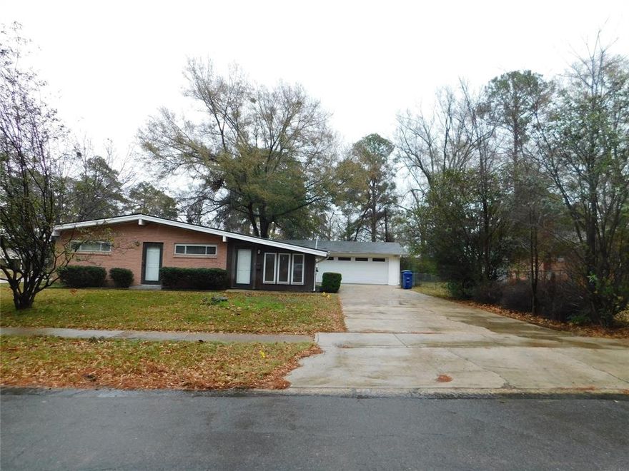 Nice home on corner lot. Two large living areas with separate front entry doors; one of the living areas could be used as a game room, dining room, family room or any other use you might find. Nice compact kitchen with plenty of cabinet space and a pantry and a cozy little dining area. Master bedroom has outdoor access to the patio and a half bath. The other 2 bedrooms are near to the master and close to the large master bath in the hallway. Home has energy efficient vinyl windows and easy care vinyl plank flooring. There is a large two car garage with an extra large space for workshop or storage. Close to retail, dining and medical facilities and major traffic arteries. Square footage should be verified by buyer or buyers agent. Property is SOLD AS IS WHERE IS. Contact a Real Estate Agent to schedule an appointment to view this property.