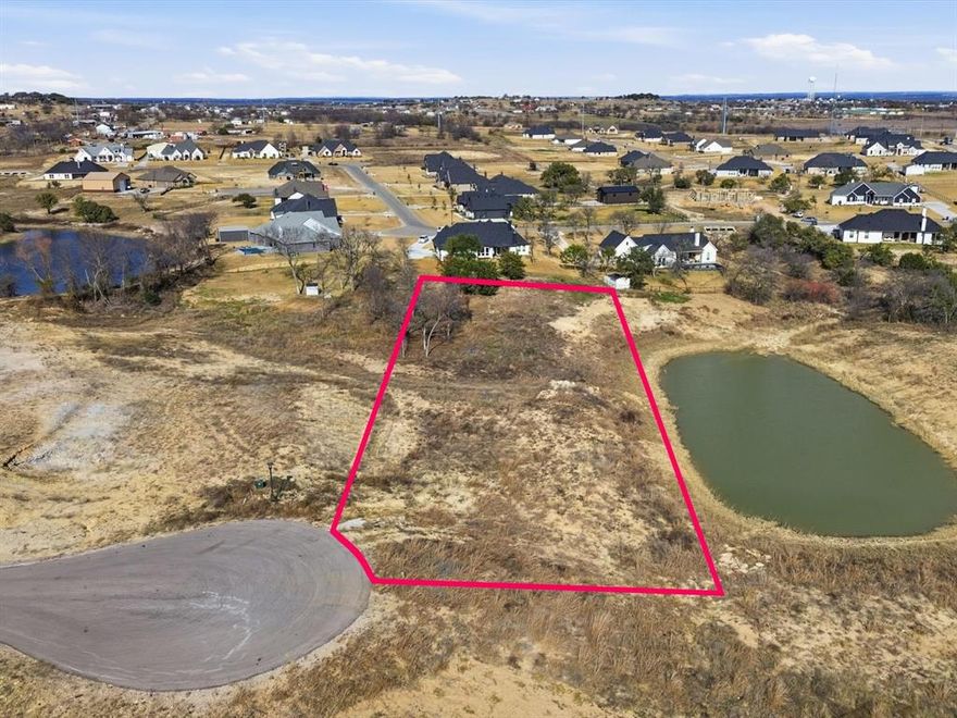 Build your dream home on this exceptional waterfront homesite in the desirable Calhoun Acres community of Azle. This picturesque lot offers a rare opportunity to design a custom residence overlooking a serene private pond, creating a peaceful backdrop for everyday living. Enjoy tranquil water views, open skies, and the privacy that comes with a thoughtfully planned neighborhood featuring spacious lots and natural surroundings.



This property is build-ready with water and electric readily available and AT&T Fiber in place, providing the convenience of modern infrastructure while maintaining a relaxed, country-style setting. With ample space for a custom build, the lot allows flexibility for your ideal floor plan, outdoor living areas, and future enhancements.



Whether you envision morning coffee by the water, evening sunsets from a back patio, or a legacy home tailored to your lifestyle, this homesite delivers the setting to bring that vision to life. Conveniently located with easy access to Azle, Eagle Mountain Lake, and Fort Worth, this location blends peaceful living with nearby city amenities.