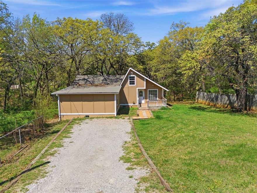 Looking for the perfect lake getaway? This beautiful 3-bedroom, 1-bath home with open loft sits right by a peaceful creek and is just minutes from Lake Texoma and Mill Creek Marina — making it an ideal weekend retreat, vacation rental, or full-time home.

Inside, you’ll find a comfortable, open feel with three bedrooms downstairs and a spacious bathroom featuring double vanities and a large walk-in closet. The kitchen offers plenty of cabinet space and flows easily into the breakfast nook — perfect for slow mornings before heading out to the lake.

Upstairs, the awesome loft-style living space overlooks the main living area and can serve as a game room, bunk room, home office, or cozy hangout spot.

Step outside and enjoy the real highlight — a large wooden back deck overlooking the creek. The firepit is already in place, ready for evenings under the stars after a day on the water. Whether you're entertaining friends or just unwinding with a cup of coffee, the backyard is made for relaxing.

Close to Lake Texoma, Mill Creek Marina, and full of charm — this is easy lake living at its best.