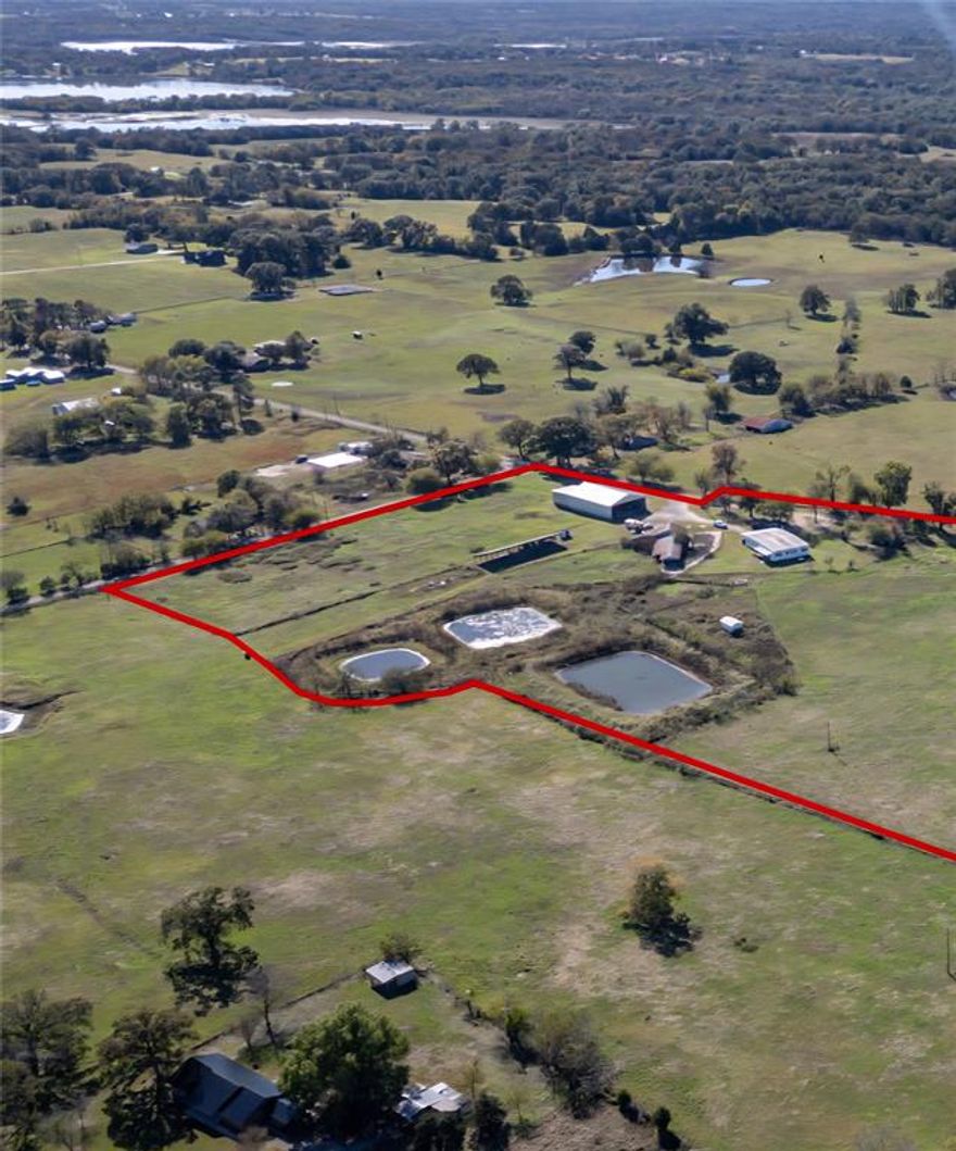 10 acre  Ag Exempt farm in Emory one mile from Lake Fork! Includes 80x50 barn with partial concrete floor for hay, 10 Stall dairy barn with equipment & solar hot water heater, ponds, water well plus co-op water, Paid off solar panels that produce 400 watts daily equal zero electric bill for this property! Amazing updated barndo with 5 bedrooms, study, three full baths and one-half bath. Open floor plan, kitchen with quartz counters, breakfast bar, double oven & wine rack.  Large open living room and dining with a wood burning stove. Split bedrooms, large master suite with separate tub, double sinks, walk in slate shower with seat and large walk-in closet. The game room is large enough for a pool table, also has a guest suite with a half bath and private porch. Luxury vinyl plank floors throughout, updated HVAC units, plumbing and electric panel.  exempt. All information is approximate, buyer and buyer's agents to verify all information.