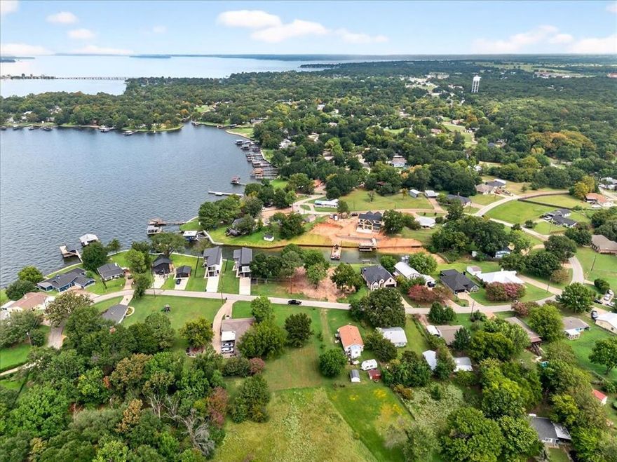 Custom new construction waterfront home in Mantle Manors, the heart of Cedar Creek Lake!  This brand new custom waterfront home in the sought after Mantle Manors neighborhood offers a combination of high end finishes, modern design, and exceptional lake access.  The home features 4 bedrooms, 3.5 baths, plus a bonus room that can serve as a fifth bedroom or flex space. The open-concept floor plan has custom finishes throughout, blending comfort and style for both everyday living and entertaining.  Set on a 120 feet of shoreline, the property provides great water depth, views and space for entertaining family and friends. The price includes new seawall, new boathouse with boat slip and PWC lift.  Outdoor living is elevated with a high-end in-ground pool featuring a water feature, creating the perfect lakeside retreat.  Construction to begin in fourth quarter, 2025.  Additional pictures forthcoming.