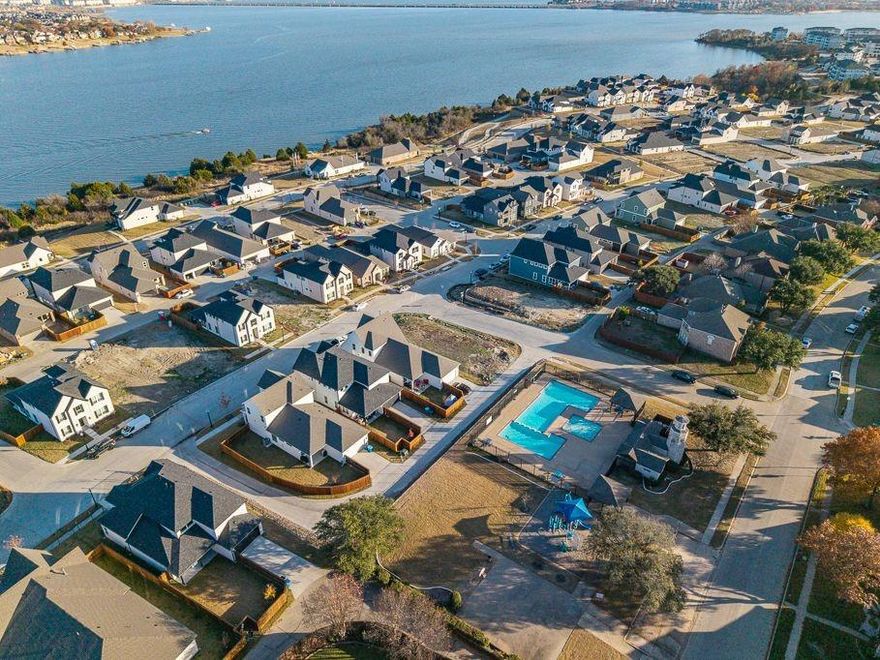 LOCVATION LOCATION LOCATION  Well established Harborside community in Rowlett JUST MIN FROM LAKE RAY HUBBARD .Open and spacious .One of a kind  4 bed 3.5 baths with 4 living areas plus 2 car garage and carport. Meticulously kept home with some  Updating including new Stunning Hardwood flooring upstairs and newish downstairs  with Marble  entryway. 2 Master retreats  one downstairs and one up. Beautiful Kitchen is a chefs delight with granite counter tops  and plenty of cabinets space  Unique layout with fireplace.Fresh paint. Remodeled Huge media and game room combo with new carpet.Large backyard with 2 built in patios plus Man cave exercise room .Electric gate also community pool and much much more. Buyer to verify all info on MLS SELLER WILL CONSIDER ALL REASONABLE OFFERS