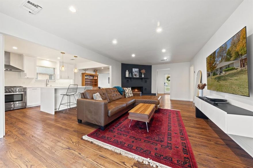 Stunningly remodeled in 2021, this home blends timeless elegance with modern comfort. The open-concept layout is an entertainer’s dream—seamlessly connecting the gorgeous kitchen island to two spacious living areas and extending outdoors to two separate patios. And the backyard? It’s truly an oasis. Lush, mature trees create a serene canopy, offering the perfect backdrop for lively weekend BBQs or peaceful evenings under the stars. As a bonus, the backyard features a premium Master H2Xercise swim spa, making winter your new favorite season. Whether you want a low-impact workout or a relaxing hot-tub soak, this year-round feature elevates daily living. Inside, the home boasts hardwood floors throughout, sleek shaker-style cabinetry extending to the ceiling, waterfall-edge quartz countertops, stainless steel appliances, and illuminated LED vanity mirrors in the bathrooms. The primary suite includes two closets. A full wall of built-ins near the entry. An oversized two-car garage with a large storage closet that can function as an outdoor living space, garage, or workout room. Storage is never in short supply. This home exudes sophistication, comfort, and thoughtful design in every detail.