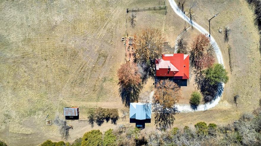 10 Private Acres in Anna with Second Dwelling Allowed — Now Offered Below Appraisal

Set on 10 usable acres with pasture, mature trees, and privacy, this architect-designed farmhouse by Dallas-based Milosav Cekic Architects offers a rare blend of land, design, and long-term flexibility.

A newly amended deed restriction allows for a second dwelling on the property with no minimum square footage and approved exterior materials including metal, brick, stone, or Hardie board. This creates a unique opportunity for additional living space, workspace, or future expansion.

The 2,223 sq ft residence features 3 bedrooms and 3 recently updated bathrooms, hardwood floors throughout the first floor, fresh interior and exterior paint, and new neutral carpet. Light-filled interiors capture peaceful views of the surrounding land.

The kitchen includes quartz countertops, a built-in Sub-Zero refrigerator, appliance garage, and pop-up mixer stand.

A detached two-car garage with second-story studio or storage space provides flexibility for work or hobbies.

The land is both functional and inviting, with fenced pasture, a half barn, and mature trees, suitable for hobby farm or recreational use. Metal roofing and solid construction throughout.