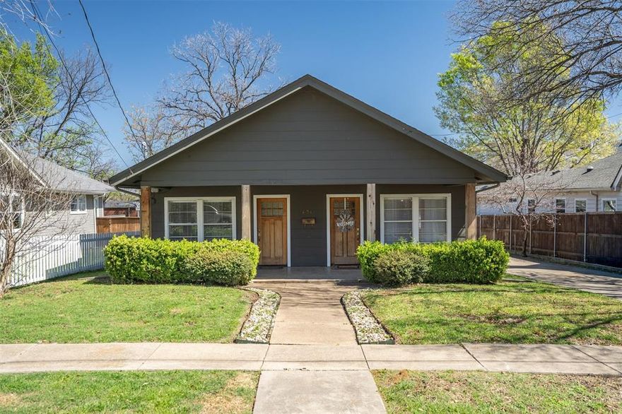 Perfectly positioned just moments from Bishop Arts, this fully renovated Craftsman duplex—offered as a complete two-unit opportunity—invites you into one of Oak Cliff’s most beloved pockets within Kings Highway Conservation District, minutes from Kessler Park. Thoughtfully reimagined with a balance of timeless charm and elevated design, the residences showcase character-rich exposed brick and curated updates, both intentional and inviting. The first residence offers 1,000+ sqft with 2 beds, 1 spa-inspired bath, anchored by an open-concept living. Warm hardwoods welcome you in, leading to a light-filled living area accented with brick, wood-plank feature wall, and designer lighting. The kitchen blends function and style with a herringbone backsplash, gas range, and stainless appliances. A versatile secondary bedroom with French doors and open closet lends itself beautifully as a guest room or office. The bathroom is a true retreat—featuring a glass-enclosed wet room, exposed brick, and rain shower for a spa-like experience. Primary opens to a private porch overlooking the fully fenced yard. The adjacent residence offers 850 sqft with 1 bed, 1 bath, and dedicated office nook—designed to maximize flow and livability. Natural light pours through enlarged kitchen windows, highlighting artisan tile, exposed brick, and a thoughtfully designed kitchen complete with wine fridge, built-in microwave, gas range, quartz counters, and stainless appliances. Handcrafted wood doors and warm finishes add a layer of character. The property is completed by a shared fenced yard, two-car garage with 17x10ft storage. Updates include HVAC (2020), tankless water heaters (2022), exterior paint (2023), and foundation work (2021) with a transferable warranty. Owner-tenant occupied, leased  through June, this is a rare opportunity to own a design-forward duplex in a walkable, culture-rich location—just moments from local favorites like Kessler Theater, Tiny Victories, Paradiso, and Eno’s Pizza.