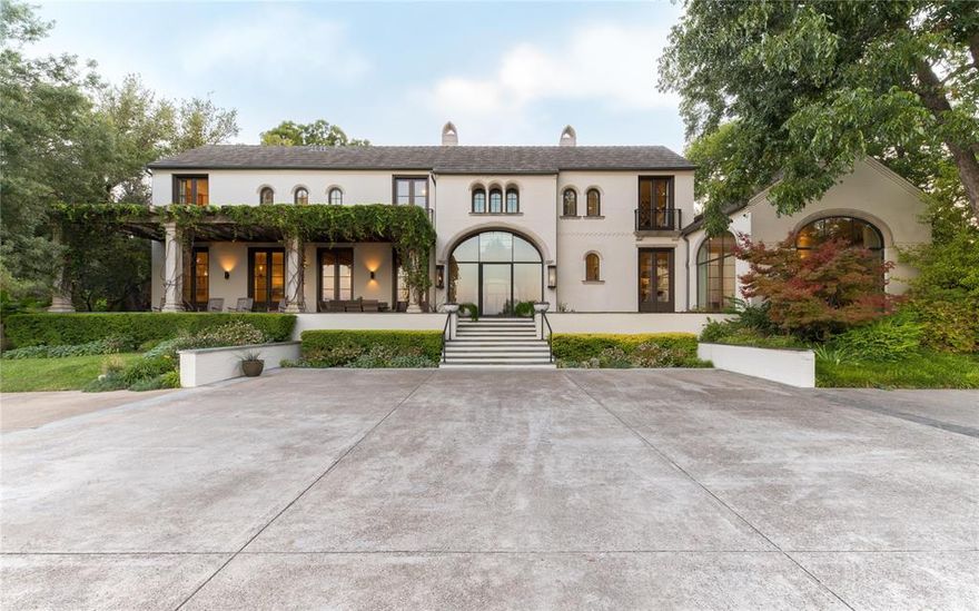 A magnificent, gated estate overlooking White Rock Lake. Masterfully built by Ellerman Homes in 2007 as a true oasis in the heart of Dallas. Artfully blending modern convenience with timeless European architectural details throughout. This mini compound totals over 10,000 square feet between two homes. The main house features 5 bedrooms and 5 full bathrooms, 4 powder baths. 5 indoor fireplaces, an outdoor shower, indoor-outdoor flow through steel-encased windows and doors. A chef inspired kitchen with a fireplace facing island. The main home features a glass encased built in wine room, 12-person theater, home gym, and several flexible space areas. Amazing natural light, and extraordinary wall space for art throughout. A luxurious backyard, with a pool, 3 firepits and pizza oven head you to the guest quarters. The guest quarters has a full kitchen, screened in porch with a separate driveway entrance. This estate sits on a 1.1-acre lot and was one of D Magazines 10 most beautiful homes.