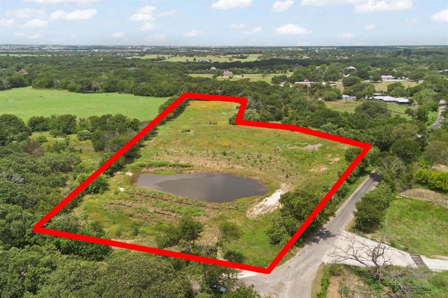 Discover an exceptional opportunity with this beautifully prepared 5-acre property—newly platted into four individual lots, giving buyers incredible flexibility for building, developing, or investing. Whether you prefer to keep the entire 5 acres together for your own private homestead or take advantage of the pre-approved subdivision, this property offers options rarely found in today’s market. The land has been thoughtfully cleared and enhanced with a deepened, improved pond designed to increase water storage and elevate potential homesites nicely. Three strategically installed tin horns—two on the left and one on the right side of the pond—allow efficient water flow beneath the soil, greatly reducing surface flooding. Additional soil has been added to both sides of the pond, enhancing stability and usability across the tract. Located outside of city limits, this property invites a wide range of possibilities. One acre in the back is cross-fenced, perfect for livestock, pasture use, or agricultural needs.
Whether you’re dreaming of a personal retreat, planning for family homesites, or seeking a smart land investment, this versatile and breathtaking property is ready for your vision. Property has deed restrictions, is in the Cleburne etj. has been replated and includes Lot 1,2,3,4. Sellers will consider selling lots separately.