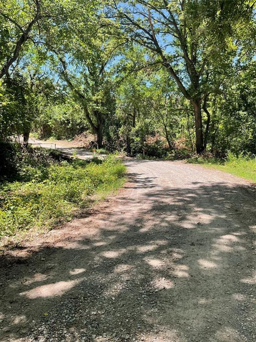 Beautiful 4.381 acres in Bonham school district. Wooded with majestic towering hardwoods including many mature Black Walnuts! Property is 100% nature's blank canvas waiting for your paintbrush.

Strategic clearing would warrant a beautiful site for your new home, cabin, RV, or land hold. The majority of the property is on the north side of CR 3040 with sandy and clear Sloans Creek bordering the west and north sides of the property. 

A portion of the property is in the 100 year flood zone per FEMA map notated in survey (see pics). This creates your recreation oasis surrounding your future build site that is not in the flood zone. This property is just a few miles to new Bois D' Arc lake and the soon to be new Ralph Hall Lake and approx 9 miles to Bonham city limits.