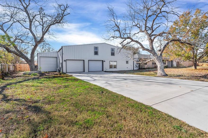 Welcome to 406 N Oak St in Tolar, TX, a home that’s anything but ordinary! With 3,300 sq ft of living space plus a 1,456 sq ft heated and cooled attached shop and gym featuring a half basketball court, office, and 1-car garage, this property is built for big lives, big ideas, and big fun.

Inside, you’ll love the open layout that brings the living, kitchen, and dining together, perfect for hosting, relaxing, and everyday life. The kitchen offers granite countertops, a farmhouse sink, and a large island with bar seating that’s ready for snacks, homework, or hosting.

The first floor is packed with space and convenience, featuring a private primary suite, plus three additional bedrooms and two full bathrooms. Upstairs adds even more flexibility with one bedroom and two bonus rooms, ideal for a game room, playroom, media room, home office, or whatever your life needs next.

Outside you’ll find a privacy-fenced backyard, a 2-car attached garage, and a carport, because you can never have too much space for vehicles, guests, or weekend projects. If you’ve been searching for a home with personality and possibilities, this one is a slam dunk.