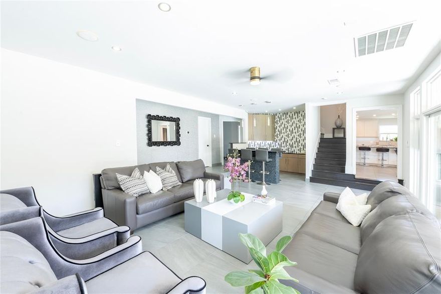 Enjoy the perfect blend of tranquility and convenience in this beautifully situated corner lot property, nestled in a well-established neighborhood. This stunning property boasts an expansive kitchen perfect for culinary enthusiasts, seamlessly flowing into a spacious living room-bar area ideal for entertaining. The open-concept design creates a perfect blend of functionality and style, making it an entertainer's dream home. The backyard of this stunning property is an entertainer's paradise, featuring a perfect spot to relax and cool off during warm weather.