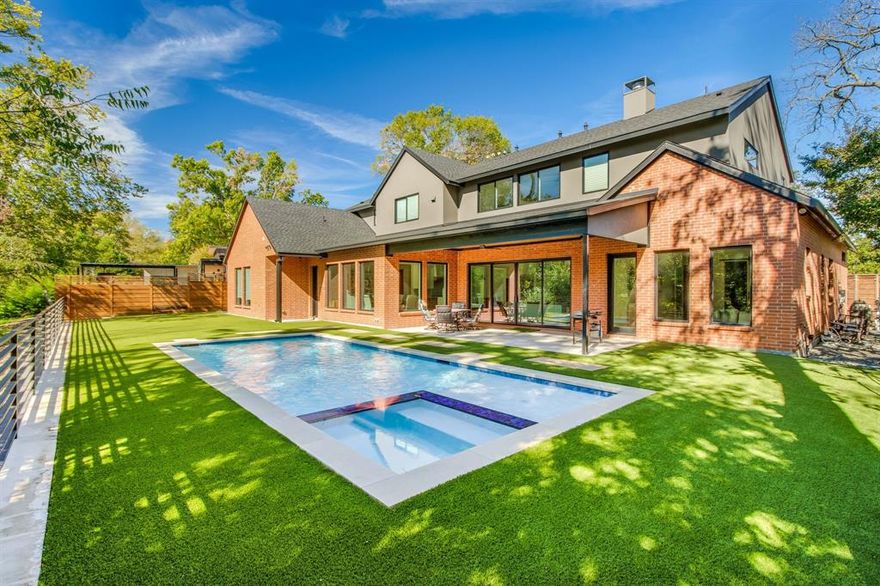 AMAZING PRICE for this BEAUTY located in the HIGHLY DESIRABLE Reservation neighborhood! NOW IS YOUR CHANCE!  Why wait to build when this 'like-new' home is move-in ready, fully equipped, and perfect for enjoying the POOL just in time for summer! Offering 5 bedrooms — Primary suite and a separate secondary ensuite on the main floor; three additional bedrooms and a game room up. The CREEK LOT, POOL, and COVERED PATIO provide additional space for entertaining — perfect timing to enjoy the pool season!  Enjoy beautiful views from every room on the first floor, set against the serene, tree-lined creek lot.  White oak wood floors, open concept with chef's dream of a gourmet kitchen featuring a column refrigerator-freezer and column wine fridge, self-closing drawers, and a 48-inch double oven with a 6-burner gas cooktop. Quartz waterfall island, a huge butler's pantry with an ice maker, 2nd sink, and dishwasher. The breakfast area has picture frame windows overlooking the gorgeous backyard, pool, and turfed yard. Living room with wood beams, linear gas log FP with shiplap surround & wood mantle. Sliding doors open to a backyard haven with a covered patio. The primary suite is a personal retreat with direct backyard access, a gorgeous bathroom with a separate shower & freestanding tub, alongside a spacious closet complete with an island, seasonal storage, & stackable washer-dryer connections for a second laundry option. Primary & guest bedroom split with ensuite bathrooms down. Upstairs hosts 3 more bedrooms, 2 with ensuite baths, a split 3rd bedroom with additional bathroom, a game room, and a bonus room that could be office, living or workout room!  This home has everything you need and is ready for a new family to create lasting memories. Feeds into Mohawk, North, and Pearce!!