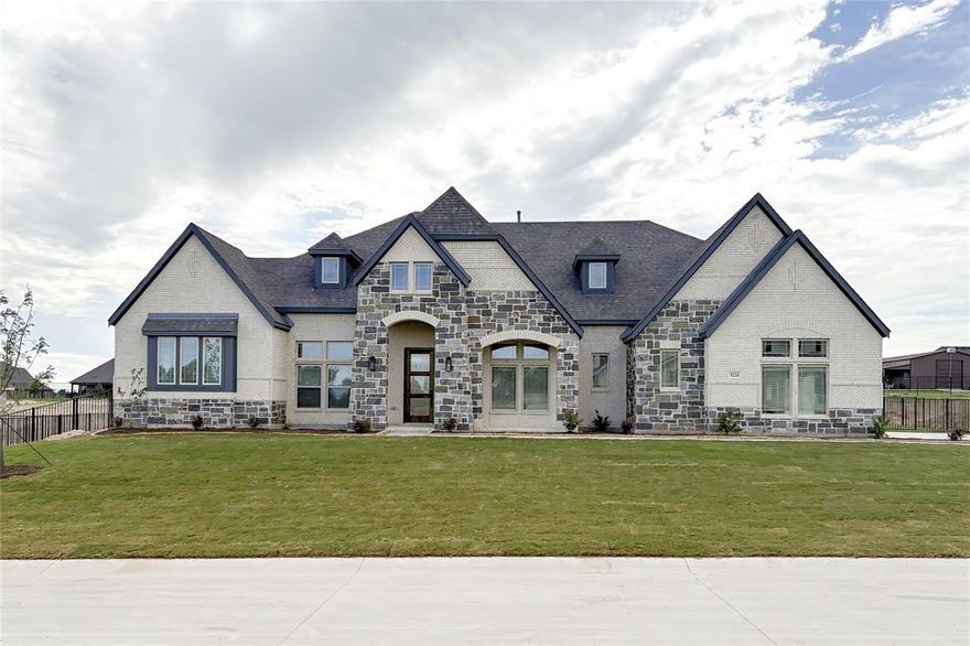 NEW & NEVER LIVED IN! Recently Completed Prototype from Bloomfield Homes: The 'Azalea' is a grand single-story home with 4 large bedrooms and 3 full baths, an open-concept family room with 6x6 beams at the ceiling and a stone fireplace, and a massive 3-car garage around the side. Gorgeous half-acre homesite is a blank canvas awaiting your touch - while the interior sports on-trend finishes to elevate your style! It all starts with a wide covered front porch and 8' front door that immediately opens to nail down wood floors and glass French doors opening to a dedicated study. All 3 secondary bedrooms are arranged on one side of the home, while the Primary Suite is privately situated in its own back corner with views of the backyard and a roomy 5-piece bath. If you need room for two, there are individual vanities separated by a deck mount tub and the giant walk-in closet is a double-sided split! Upgrades in the Deluxe Kitchen add function and beauty like Level 5 Calacatta Extreme quartz countertops, stainless steel appliances built into the stained Shaker cabinetry, and added storage space for all your gadgets. A covered rear patio sits outside the family room, able to access from doors on opposite ends - either from the dining nook or game room hallway. The floor plan flows naturally to fit life, with a mud room off the garage and laundry with a sink. Other additions include a gas drop for a grill on the patio, gas logs and direct vent at the fireplace, 8-foot interior doors, upgraded wall tile accents, 2-inch faux wood blinds, gutters, an irrigation system, landscaping package, and fully fenced backyard. Builder warranty included. Bloomfield Homes is open daily at our nearby model home - call or visit to learn more!