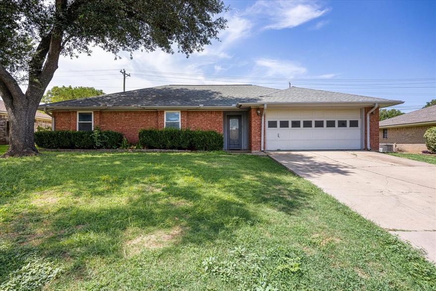 Enjoy the charm of classic brick design with this 3-bedroom, 2-bathroom home nestled in a highly sought-after neighborhood, just right around the corner from the golf course! Wake up to the beauty of golf course living, where the convenience of being close to the greens sets the tone for everyday life. Inside, the home offers a warm and inviting open floor plan, highlighted by a spacious living room with a beautiful brick, wood-burning fireplace, and a built-in oak entertainment center. The kitchen boasts ample cabinetry and storage, making it both functional and stylish. Generously sized bedrooms and a flexible layout provide plenty of room to make the home uniquely yours. Step outside to enjoy the fenced backyard—perfect for pets, play, or private outdoor gatherings. With its timeless style, thoughtful features, and unbeatable location, this property blends comfort, character, and the lifestyle of golf course living. Schedule your showing today!