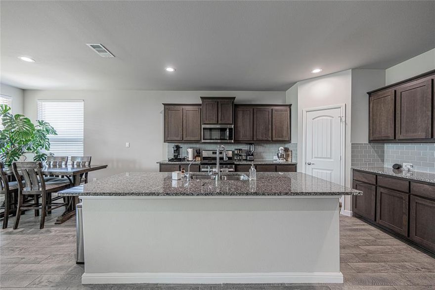 Impeccably maintained and thoughtfully upgraded, this 3-bedroom, 2-bath home with a dedicated office-study nook offers an exceptional blend of comfort, style, and value. The study can also function as a fourth bedroom. Built in 2023, the home features a beautiful open-concept layout filled with natural light, flowing seamlessly from the spacious living area to the well-appointed kitchen which features a five burner gas range, stainless appliances and a beautiful large kitchen island. The extended primary suite boasts a generously sized walk-in closet, large walk-in shower, and dual vanities, providing a true retreat.The outdoor living experience is equally impressive, showcasing an expansive extended patio, upgraded turf, and striking low-maintenance landscaping—ideal for entertaining or unwinding in peace.With its larger-than-typical lot, extensive builder upgrades, and numerous premium owner-installed improvements, this home is priced significantly below comparable new construction in the area—offering a rare opportunity for outstanding value. With one of the most pristine yards in the subdivision, curb appeal is just the beginning a a true complete package deal! Notable enhancements include a brand-new upgraded roof (2024), water softener, tankless water heater, water filtration system, and more. For added convenience, the washer, dryer, refrigerator, and a high-end security system—including cameras—may convey with an appropriate offer. Midland’s BRAND NEW Legacy High School is in the works and just down the street! As well, this home is perfectly situated just steps from the community pool and playground, and minutes from Midland’s finest shopping, dining, and entertainment including the brand new Midland Zoo (coming soon),  this home delivers style, convenience,  and livability in one remarkable package!