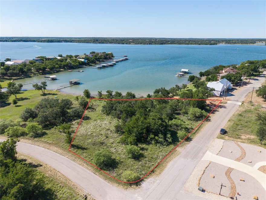 The lake is full and summer is quickly approaching. Bring your builder to this highly desirable lake front property in beautiful Feather Bay on Lake Brownwood. Come enjoy the award winning Hideout Golf Resort, Pool, Incredible Dining, RV Hookups and much much more all with in the awesome confines of the Feather Bay subdivision. Quick access to Brownwood, TX and easy access to I20 that can get you to Dallas, Fort Worth or Midland ,Odessa. The lot itself has some mature trees and gently slopes to the lake. Making this a easy build location for that custom home you've always wanted. This is a double Lot at the mentioned price. The Lots can be purchased separately if one desires.