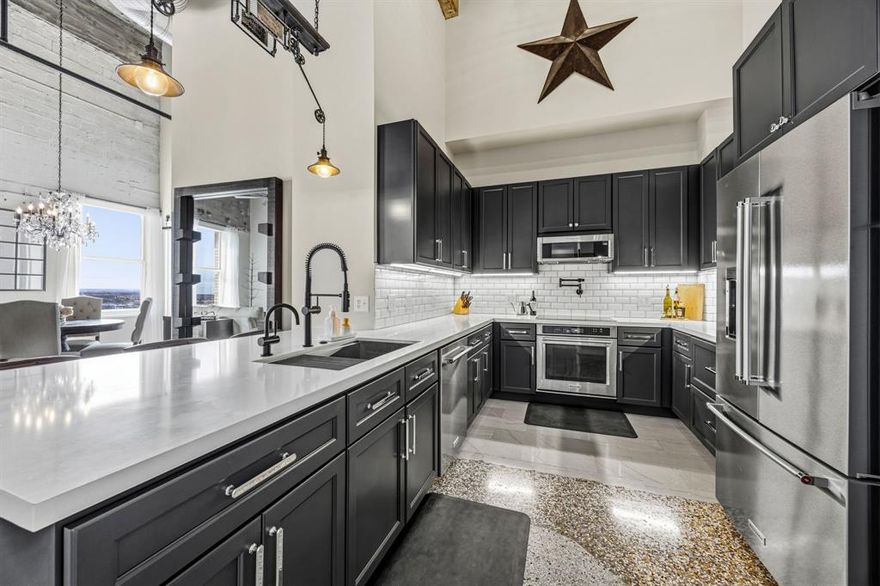 Penthouse-level corner residence inside one of Fort Worth’s most iconic historic landmarks. Located in Texas & Pacific Lofts, this rare 12th-floor unit is one of only two on the top floor offering south and west exposures with beautiful sunset skyline views.
Completely remodeled in 2022, the home blends original exposed concrete with thoughtful modern updates throughout. Soaring ceilings, polished terrazzo floors, oversized windows with custom sound-reducing inserts, and a redesigned kitchen with quartz countertops and custom cabinetry that include in cabinet and under cabinet lighting create a refined yet industrial downtown retreat. Updated baths, a new HVAC system and ducts (2022), reverse osmosis drinking water system, and enhanced sound insulation in the primary bedroom (the unit’s only shared wall) provide comfort and privacy allowing you to enjoy downtown living without the downtown noise. 
Conveniently located near the elevator for easy access.
Direct access to TRE and TEXRail provides convenient service to DFW Airport and downtown Dallas. An exceptional advantage for frequent travelers and commuters.
Residents enjoy 24 7 concierge service, fitness center, resistance pool, owner’s lounge, multiple courtyards (including pet-friendly space), controlled-access parking with two unassigned spaces, exterior insurance, high-speed internet, cable, trash, sewer, and grounds maintenance.
Within walking distance to Sundance Square, the Water Gardens, South Main, Magnolia, museums, dining, major event venues, and everything Downtown Fort Worth has to offer.