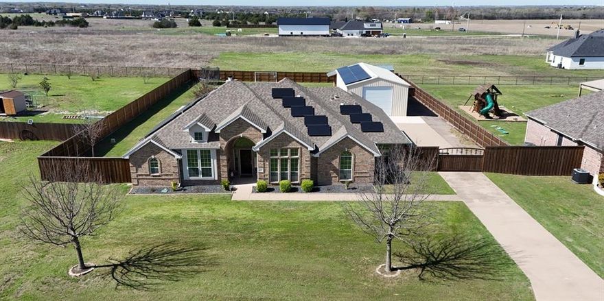 *OPEN HOUSE SAT MARCH 21, 12-3* RARE find! Check out this beautifully maintained home is Waxahachie’s sought after Northeast Meadows neighborhood located outside Waxahachie city limits. With no HOA and nestled on 0.66 acres, this property offers the perfect blend of space, privacy, and convenience to town.

Step inside to a grand living room anchored by 12-foot ceilings, decorative beams, and a cozy wood burning fireplace that creates a warm and inviting space. The recently remodeled kitchen features stunning granite countertops, glass tile backsplash, under-cabinet and toe-kick lighting, and new tile flooring throughout. The thoughtful floor plan includes 4 bedrooms, 2 bathrooms, and a dedicated office ideal for working from home.

The outdoor space is just as impressive. Enjoy your own backyard retreat featuring an in-ground pool with finished landscaping, a fire pit area, and plenty of yard space on this expansive lot. This property also offers exceptional storage and workspace, including a large 24 x 50 metal shop with epoxy flooring and electricity, two storage sheds, and a 2car garage. New fencing has recently been installed.

Enjoy the additional benefits of energy efficiency and long-term savings with the solar panels that will be fully paid off at closing! Homes with this much land, a pool, workshop, and modern updates are hard to find—don’t miss your opportunity to own this unique property!