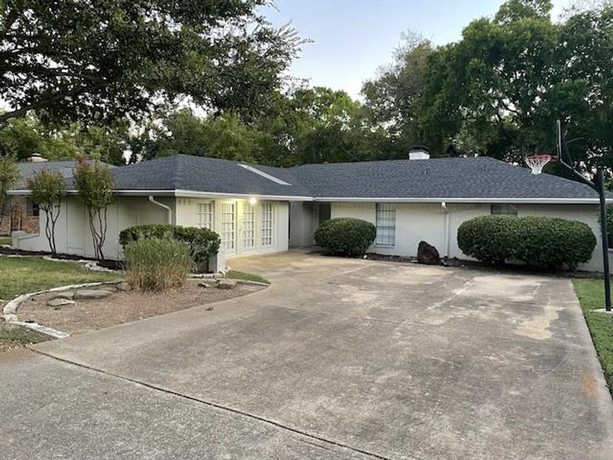 New roof installed!!!! Nestled in a prime location at 1942 S. Lakeshore Drive in Rockwall, TX, this beautifully renovated 3-bedroom, 2-bathroom home offers a fantastic blend of modern comfort and natural beauty. Step inside to discover fresh new flooring and paint throughout, creating a bright and inviting atmosphere. The updated kitchen boasts brand-new appliances, ready for you to create culinary delights.

Imagine relaxing in your own backyard oasis, as this property backs directly onto a serene creek, providing picturesque views and a sense of tranquility. Nature lovers will appreciate the peaceful ambiance.

Convenience is key with this location, as you'll find yourself just moments away from the popular Lake Ray Hubbard. Enjoy easy access to boating, fishing, parks, and all the recreational activities this expansive lake has to offer.

This move-in ready home presents a wonderful opportunity to embrace comfortable living in a desirable Rockwall neighborhood with stunning natural surroundings and close proximity to lake adventures.