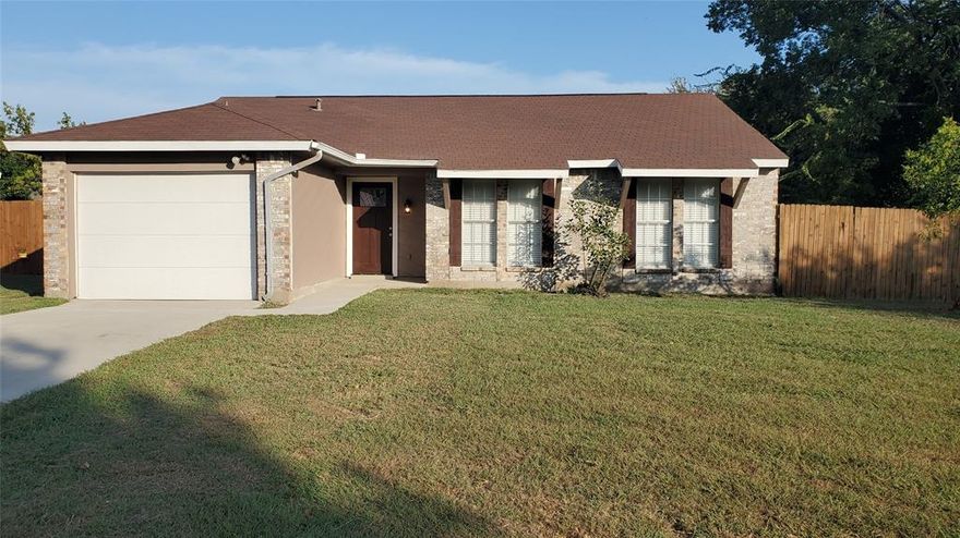 Don't miss out on this charming 3 bed, 2 bath home! On a 0.285 acres lot located just minutes away from I-30, food, entertainment, and Lake Ray Hubbard!! This home offers an open floor plan throughout! Spacious entryway leading into the cathedral-ceiling living room featuring a timeless brick fireplace. Plenty of windows for natural lighting and so much more!  House just recently had new carpet installed and kitchen updates.  Corner lot.  Big backyard!!