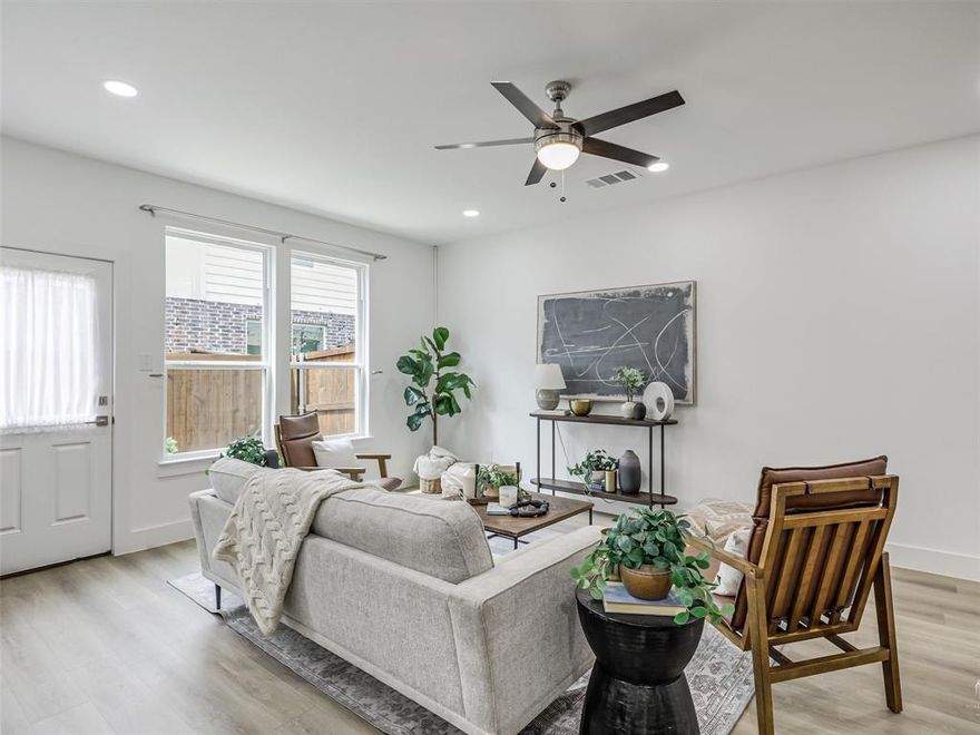 Why wait on new construction when this barely lived in, 2023 townhome is move in ready? Great location, situated minutes from Dallas Love Field, Dallas Medical District, Dallas Uptown, Trinity Groves and Cedar Springs. Enter the grand foyer of this stunning two bedroom, two and a half bath home that features a comfortable layout for quiet nights in or a fun evening entertaining guests. The kitchen boasts quartz countertops and stainless steel appliances. For added convenience, this home includes refrigerator and full size washer and dryer. The spacious primary bedroom and en-suite bath has a luxurious, spa like aesthetic. The shower features dual shower heads and a shower bench. A quaint balcony is perfectly located upstairs just off the primary bedroom. Generous walk in closet with space to do additional shopping. Two living areas, first floor has large window with lots of natural light and upstairs is spacious and includes a cozy corner with a built in desk. 
Enjoy the back patio and indoor outdoor entertaining. The convenient low-maintenance turf is beautiful year round. All that is missing is YOU!