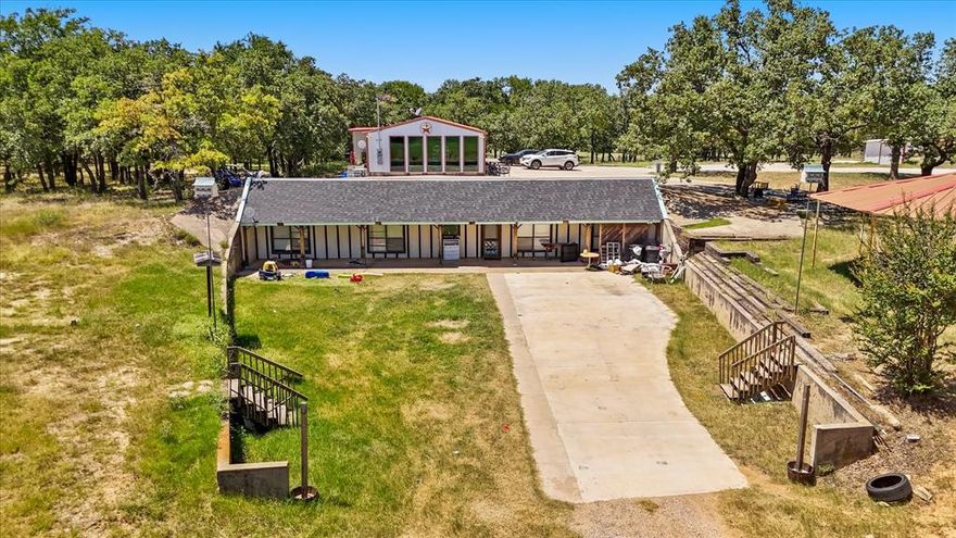 Discover this exceptional 33-acre property offering a rare blend of functional living space, natural beauty, and equestrian amenities. The estate includes two barndominiums, each thoughtfully designed with 3 spacious bedrooms, 2 full bathrooms, a complete kitchen, and laundry room. One barndominium is set up as a mother-in-law suite and has been recently updated with fresh interior paint, providing a move-in ready space for extended family or guests. The second barndominium offers an expansive 2,622 sq ft of living space, perfect for a primary residence or rental opportunity. The land itself is a mix of open and wooded acreage, offering both versatility and privacy. A picturesque private pond creates a peaceful retreat for fishing or relaxation, while fully equipped horse stables make this property ideal for equestrian enthusiasts or those seeking space for livestock. With plenty of room for trails, barns, or future development, the opportunities are endless. This property combines the tranquility of rural living with the convenience of nearby amenities. Whether you are searching for a multi-generational homestead, an equestrian estate, or simply a private country retreat, this unique property has it all.