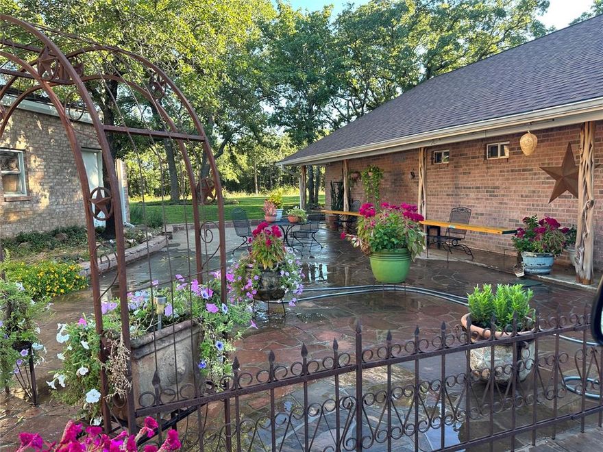 Amon G Carter Lake LAKEFRONT 1.85 Acre lot on a corner with a BOAT DOCK and 300 ft of shoreline.  This lake house is on the North side of the lake and in one of the best fishing coves on this lake and it is across from the GOLF COURSE! There is no HOA and no restrictions.  This home is on a corner and has road access .  There is a lato two streets. Lake view from all rooms of the home with a wall of windows across the back of the home.  There is a separate guest suite with its own entrance and full bath and small kitchen and closet.  There is a huge greenhouse with concrete floor and electric and water.  The lot has had dirt work to level and slope and it has many mature oaks and landscaping and a large front and side patio area. The main living area has an Austin stone fireplace floor to vaulted ceilings.  This is a RARE find with the amount of land and on the best side of the lake and in this great cove and across from the golf course with a boar dock.  The house has two bedrooms and two baths. RARE set up on Amon G Carter lake.  Across from Golf Course, Close to Hwy 287, Fairly constant level lake, Fishing Lake, Great Location! Rare find!