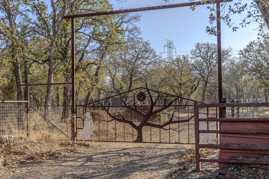 89+ Acre Multifunction Ranch offers a rare blend of natural beauty, modern comfort, rich history and true Texas charm. Owned and lovingly maintained by the same family for 20+ years, the property is ideal as a weekend escape, permanent residence, working ranch, or dedicated hunting retreat. A well-appointed two-bedroom, one-bath barndo, serves as a comfortable turnkey residence. The home features granite countertops, modern appliances and an open layout. The back porch—with its antique wood stove creates the perfect gathering place for relaxing evenings, starlit conversations or warming up beside a crackling campfire. The ranch is thoughtfully improved with infrastructure that supports livestock, recreation, and ranch operations, including: Multiple livestock sheds, Large pole barn for equipment storage, Fully enclosed work barn, Aviary for chickens or other fowl, Goat-proof perimeter and cross fencing. Buried freight container serving as a storm shelter. Reliable water well with lines distributed throughout the ranch. Land, Water & Wildlife. Heavily wooded with a variety of hardwoods, dramatic elevation changes, and open meadows create a ranch landscape far larger in feel than its acreage suggests. Numerous dirt and rock roads thread through the property, opening access to every corner. A crystal-clear, year-round tank—stocked with large bass and perch and equipped with an aerator—provides a stunning focal point as well as dependable water for wildlife and livestock. The ranch is a haven for wildlife, offering exceptional hunting opportunities for deer, turkey, dove, ducks, hogs, and varmints. A 100-yard rifle range further enhances its hunting amenities. Adding uniqueness and undeniable charm, portions of the historic Weatherford, Mineral Wells & Northwestern Railway once traversed this ranch. Remnants of the old railroad and the impressive rock bridge built in 1907 still stand as landmarks providing a tangible connection to Texas’ early boomtown history.