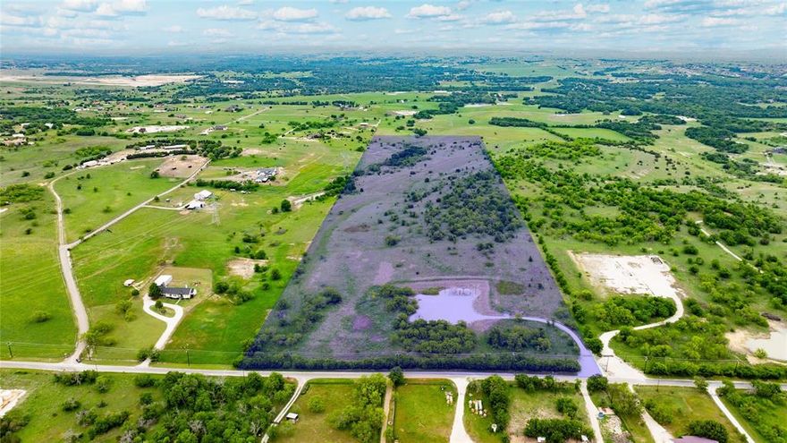 A Once-in-a-Lifetime Opportunity, 50 Acres of Untapped Potential in Aledo! Perched atop one of Aledo’s most breathtaking hilltops, this extraordinary 50-acre property offers a rare blend of limitless potential, sweeping Texas views, and unmatched privacy—all with zero HOA restrictions. Whether you're envisioning a legacy estate, luxury retreat, income-producing Airbnb compound, or boutique bed & breakfast, the canvas is yours to create. Just minutes from the upcoming Bluejack Ranch Golf Course—a world-class destination brought to life by Tiger Woods and designed to be a hub for golf, tennis, pickleball, and high-end social events—this property stands in the path of progress, perfectly poised for both personal enjoyment and future value. With rolling pastures, panoramic hilltop vistas, and four existing water wells, the land is not only beautiful, but practical and primed for development. Investors, developers, or dreamers alike will see the rare opportunity to build something enduring—whether it's a wellness resort, a private event venue, or a secluded family compound with room to grow for generations. This is more than just land—it’s the foundation for a vision. A destination in the making. A future legacy. Welcome to 50 acres of possibility in the heart of Aledo.