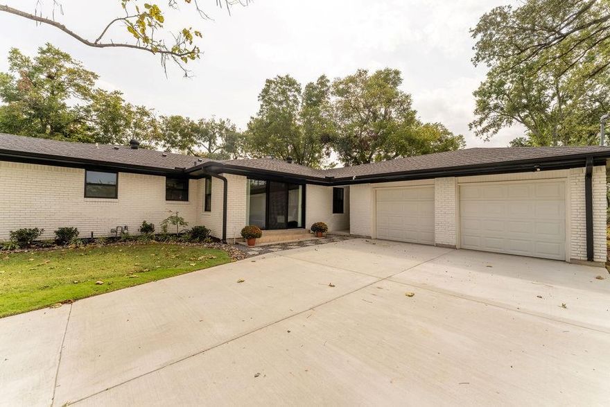 FULLY RENOVATED MID-CENTURY HOME ON RARE .40-ACRE CORNER LOT IN sought-after area! Discover modern comfort and classic charm in this completely reimagined 3-bedroom, 3-bath home with NO HOA and space for pool, RV, boat, or workshop. Every inch has been upgraded—NEW windows, NEW sheetrock, NEW interior-exterior paint, NEW hardware, NEW appliances, NEW doors, NEW lighting, NEW mirrors, NEW toilets, NEW tile finishes, NEW exterior concrete, NEWER roof & HVAC, and refinished real wood flooring throughout—no carpet anywhere with large designer tiles in wet areas. ALL APPLIANCES INCLUDED Gas Range-Washer-Dryer-Microwave-Refrigerator. Enjoy a wraparound floor plan offering both openness and privacy, with two primary bedrooms, one featuring patio-separate access. The corner lot offers long side access provides mature trees, professional landscaping, sprinkler system. Walk or bike to Downtown Terrell’s shops, cafés, and local events, or relax at Ben Gill Park with trails, lake views, and picnic areas just minutes away. Terrell delivers small-town charm with city access—12 miles to Forney, 35–40 minutes to Downtown Dallas via US-80, or I-20 to Arlington and Fort Worth in under an hour. Nearby amenities include Baylor Scott & White Medical Center, Outdoor enthusiasts love reach of Lake Ray Hubbard and Lake Tawakoni for boating and fishing. The city is actively revitalizing its historic core while maintaining its character, and proposed DART Silver Line extensions could make Terrell a future rail connection—ideal for long-term growth and value. This property blends modern design, flexible living, and investment potential—a rare turnkey home on one of Terrell’s most walkable, established streets. High-speed internet ready!