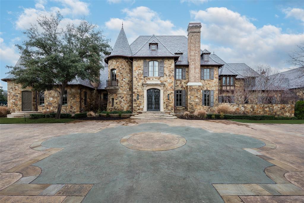 Nestled on a prestigious 2-acre estate in Preston Hollow, this custom-built home showcases architectural excellence and award-winning craftsmanship. Behind a fully walled and gated entrance lies an entertainer’s paradise, thoughtfully designed to cater to every age and interest.
The excitement begins in the basement, featuring a state-of-the-art movie theater, wine storage, a full bar, and a cozy fireplace. The main level boasts expansive gathering spaces, a gourmet open kitchen, and another full bar—perfect for hosting. A beautifully designed office near the primary suite offers an ideal work-from-home retreat.
Upstairs, five spacious guest suites await, along with a dedicated playroom. Fitness enthusiasts will appreciate the full-sized basketball gym and workout area, which can also double as a showcase garage for your prized auto collection.
Step outside to embrace resort-style living with an outdoor kitchen, a luxurious pool and spa, a putting green, and a full-size tennis court. The sprawling grassy yard adds to the home's charm, offering endless possibilities for recreation and relaxation.
This extraordinary property delivers an unparalleled lifestyle experience. Schedule your private tour today!