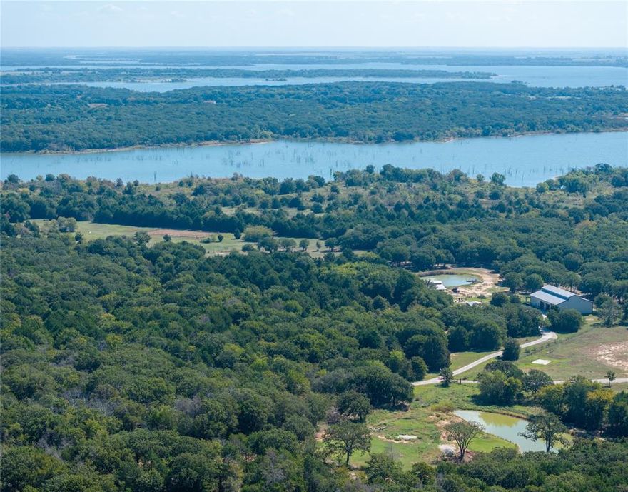 Hidden Gem backing up to Lake Ray Roberts with Great Building Sites for your Custom Home* 29.75 acre Lakefront property, Lots of Trees, pastures manicured, walking path to the Lake* Barndominium 5,820 Total Sq. Ft. (2256 Living Sq. Ft.* 2 Bedroom, 2.5 Bathroom* Vinyl Wood Floors Downstairs* Custom Kitchen Cabinet's* Stainless Steel Appliances* Granite Countertops in the Kitchen and Bathrooms* Big Closets off of the Bathrooms* Gorgeous view of the property from downstairs as well as upstairs* Huge oversized Living Area upstairs with a oversized closet* HVAC and Water Heater all Electric* 3564 Sq. Ft. in the shop area* Sink,washer and dryer connections in the shop* 3, 12 ft. Doors* 1, 14 ft.  Door for your RV or Bus* 15 x 60 Covered Patio overlooking the pasture for cooking and entertainment)* Firepit for Relaxation in the Evenings* 5,000 Gallon Koi pond with a Covered Metal Roof above full of fish* 30,000 Gallon Holding Tank for the 1,000 Ft Deep Well for putting water in the pond or the sprinkler system for the yard* 5 Stall Horse Barn with Tack Room and Feed Room* 3 Deer Blinds on the property* 1 feeder for the fish* 1 feeder for the Deer, Turkey and Hogs* 12 Bee Hives, 3 Cows for the Ag Exempt* Pentex for Electric* Mountain Springs for Water* The commute to DFW Airport, Casino in Oklahoma, Shopping not that far for Living on the Lake with Privacy!!