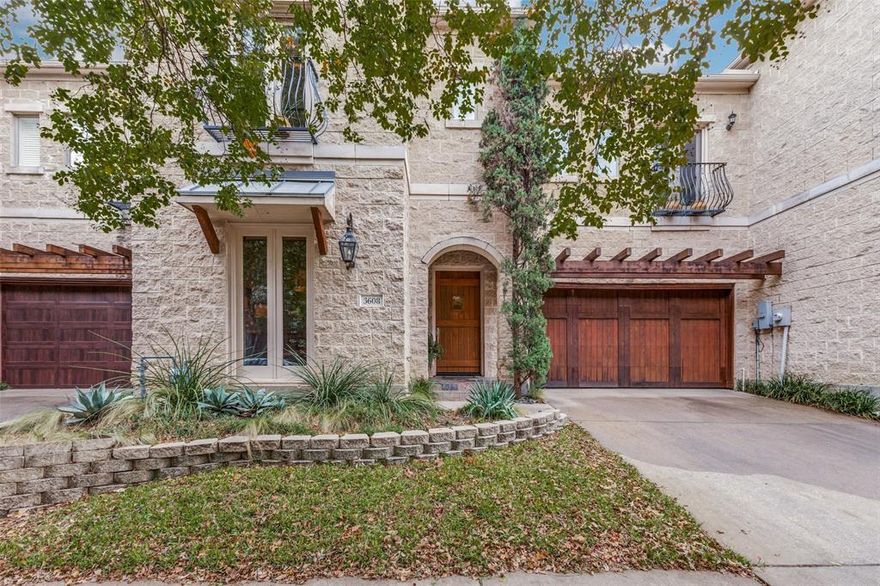Buyers will be captivated by the sophisticated, timeless elegance of this custom two-story Mediterranean-style stone townhome — no HOA — ideally located in the heart of Oak Lawn. Designed with a transitional aesthetic, the home is the perfect blend of tradtional and contemporary design. Rich hardwood floors, exposed wood beams, and custom cabinetry add warmth and character throughout the main level. The formal dining room offers versatility as an intimate entertaining space, study, or library. The open-concept living room and kitchen provide an ideal setting for hosting larger gatherings. Culinary enthusiasts will appreciate the chef’s kitchen featuring a Bosch gas cooktop, Jenn-Air double ovens, wine refrigerator, and abundant storage.  The living area is centered around a striking fireplace with a designer mantel and custom built-in entertainment cabinetry. Step outside to the private garden patio — the perfect retreat for morning coffee or evening relaxation. Upstairs, all three generously sized bedrooms feature ensuite baths, along with a well-appointed laundry room complete with cabinetry, sink, and utility closet. The primary suite is a true sanctuary, offering a sitting area, private balcony, and its own fireplace. The spa-like bath includes an oversized dual-sink vanity with makeup station, jetted soaking tub, and separate shower. The expansive walk-in closet boasts custom built-ins, dressers, shelving plus plenty of hanging space. Designer lighting, custom draperies, and window treatments convey with the home. Enjoy living in a vibrant, walkable neighborhood with dining, shopping, and entertainment — all just blocks away — plus effortless access to the Dallas North Tollway. Ask your agent for a list of improvements.