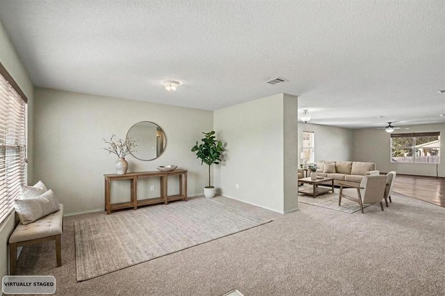 Discover this stunning two-story home situated on a spacious corner lot, offering four spacious bedrooms and 2.5 baths. You'll enjoy an open-concept on the main floor, creating a bright, welcoming space that seamlessly connects the living and dining areas, with a modern kitchen as the heart of the home, equipped with ample cabinetry. Upstairs, the primary suite is a private retreat featuring a walk-in closet and a vast ensuite bath. Three additional bedrooms provide versatile options for a home office or house guests—the possibilities are endless. Unwind on the screened-in patio overlooking the private backyard, perfect for outdoor entertainment. With a two-car garage, stylish finishes, and proximity to local schools, parks, shopping, and major highways, this home embodies comfort, space, and opportunity—an excellent foundation for your vibrant lifestyle. Don't wait, and take advantage of this opportunity to schedule your exclusive showing today!