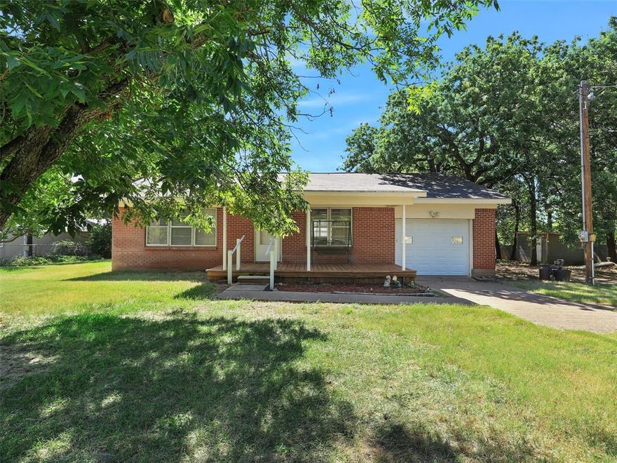 New Listing on Amon G. Carter Lake! This 1,698 square foot home offers .86 acres of prime waterfront land on the deep side of the lake, complete with a private dock. Perfect for those seeking a peaceful retreat with scenic views and water access. The home features a cozy 2 bedroom, 1 bathroom layout, with an inviting living room, eat in kitchen, and a convenient laundry room. In addition, a detached workshop provides ample space for hobbies and projects, along with three covered parking spots. Located just over an hour from Fort Worth, this property offers the ideal balance of lakefront serenity and accessibility. If you’re looking for a waterfront getaway, this is a must see!