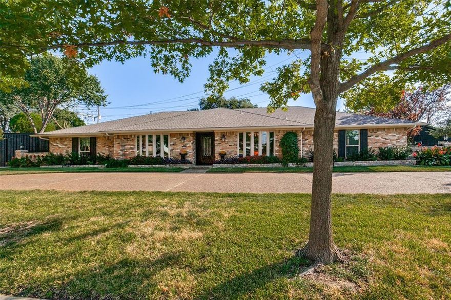 Wonderfully updated, elegant, traditional home with huge rooms on a large, private, corner lot, on its own little island! Cast iron plumbing has been replaced! Spacious living room is open to kitchen, with a fireplace, skylight, vaulted ceiling & 2 glass double doors leading to the back yard. Kitchen has a large island, granite countertops, wet bar, tons of storage & a breakfast room overlooking the pool. The primary bedroom has a raised ceiling, wood flooring, access to the back yard & ensuite bath, with separate shower & jetted tub. Second and third bedrooms have a Jack & Jill bath. Fourth bedroom is split & could be a game room or in-law suite with its own entry & full bath. Large utility room with sink, built-in cabinets & room for freezer. Back yard has a patio, grass, built-in grill & pool with waterfall & fire features. The garage is oversized & ample room for parking on private drive or circle drive. Recent updates & upgrades include: Kitchen, den, pantry remodel (2025), French Drain installed (2024), Art Studio built (2024), Fence perimeter & pool gate installed, including electric security gate, driveway replaced (2024), Artificial grass installed in back yard (2024), Lifetime doors & front windows replaced (lifetime guarantee) (2023), Replacement of soffit & fascia for entire house (2023), Water heater replaced (2020), Carpet in 3 secondary bedrooms replaced (2020), Water shutoff & sprinkler underground control replaced (2020), Critter Control: removal & installation of attic insulation, critter retardant, repairs to HVAC systems, electric temperature controlled attic turbines (2020). Complete update list available upon request. Located in the Private School Corridor, ON the Northaven Trail, walking distance to the Town North YMCA and Northaven Park offering a playground, tennis courts & baseball field! Significant Tax Break allowed due to location!