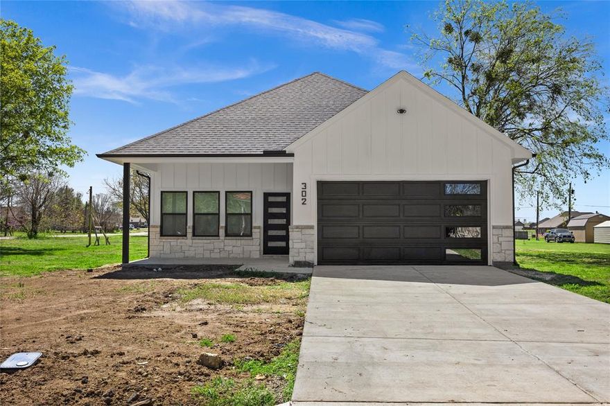 Brand-New Modern Farmhouse on a Corner Lot in Mabank located 15 min from Cedar Creek Lake! A beautifully designed 3-bedroom, 2-bath new construction home that blends modern style with comfortable living. With eye-catching white smart siding, black windows and finishes, and stone accents, this home offers standout curb appeal from the moment you arrive. Step inside to an open-concept living space filled with natural light, tall ceilings, and stylish modern fixtures. The spacious living area flows seamlessly into a stunning kitchen featuring custom cabinetry, sleek black hardware, a large center island, and contemporary lighting—perfect for entertaining or everyday living. The primary suite is designed for comfort and privacy, complete with a walk-in closet and a spa-inspired en-suite bathroom featuring designer tile, modern black fixtures, and a sleek glass shower. Enjoy peaceful mornings or relaxing evenings on the covered front porch or the covered back porch, providing great outdoor space to unwind or entertain.