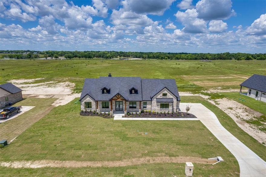 Brand new construction on one acre in Celeste, TX. This stunning 4-bedroom, 4-bath home features an open-concept layout with solid hardwood floors throughout the main living areas and a modern kitchen with quartz countertops and stainless steel appliances. The primary suite offers a private retreat with a luxurious en-suite bath and walk-in closet. Additional bedrooms are spacious, with a versatile flex space perfect for a kids’ playroom, home office, or additional living area. Energy-efficient design and quality craftsmanship throughout. The expansive lot provides plenty of outdoor space for gardening, entertaining, or future expansions. Located in a peaceful country setting, yet still close to local amenities. Move-in ready—this home combines modern luxury with country living. Don’t miss out—schedule your showing today!